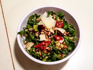 A bowl of Winter Orzo and Arugula Salad.